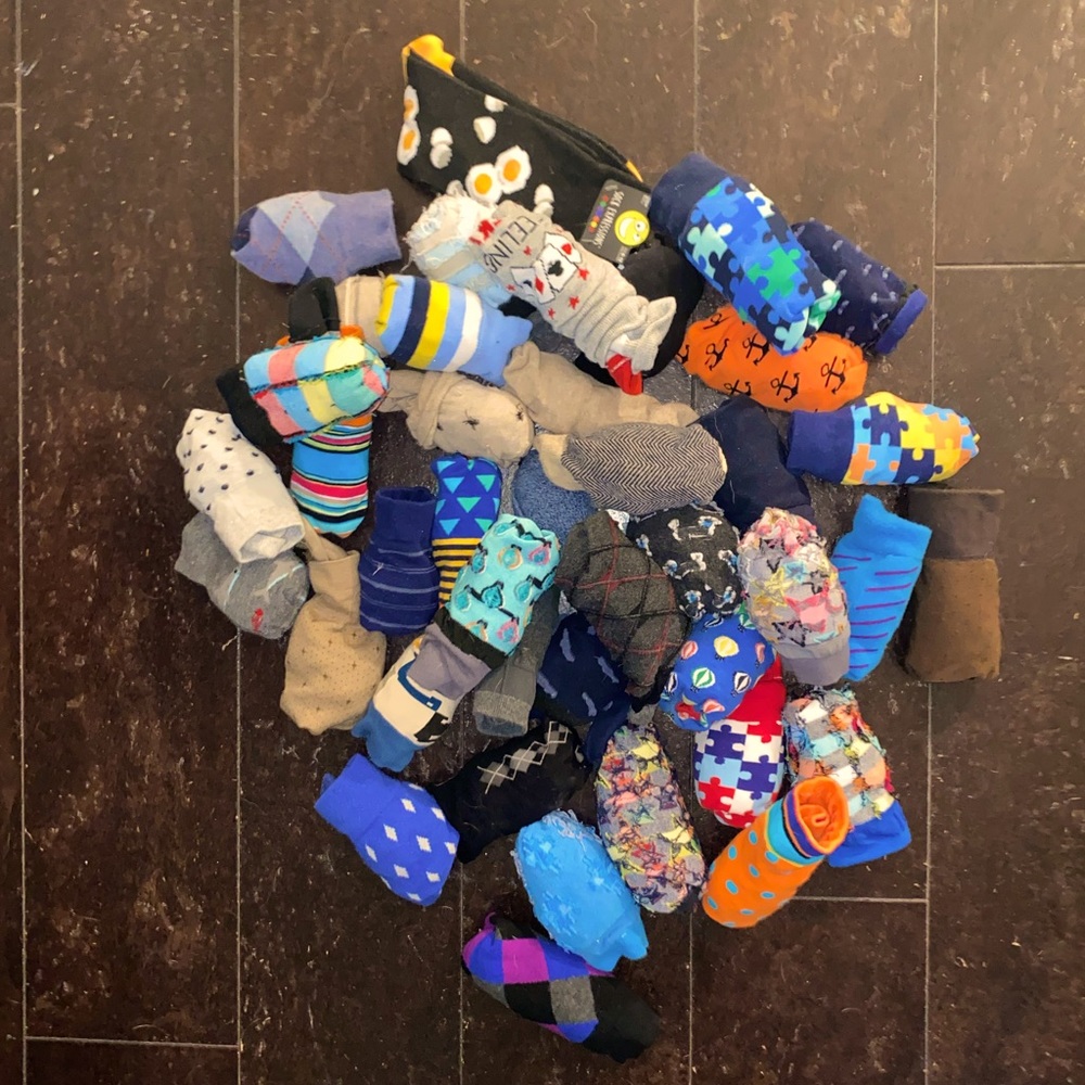 Lot of 42 pairs of novelty and dress socks.